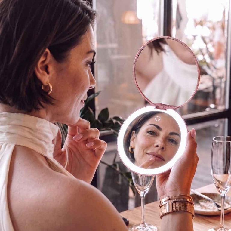 Taylor Lighted Compact by Fancii & Co. Open and being used to check teeth at resteraunt