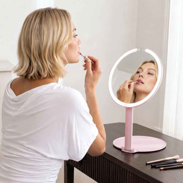 Fancii Abigail Travel Mirror with LED Lights Hero Extended and Folded Down In Use, Folds Out Anywhere

Pink None